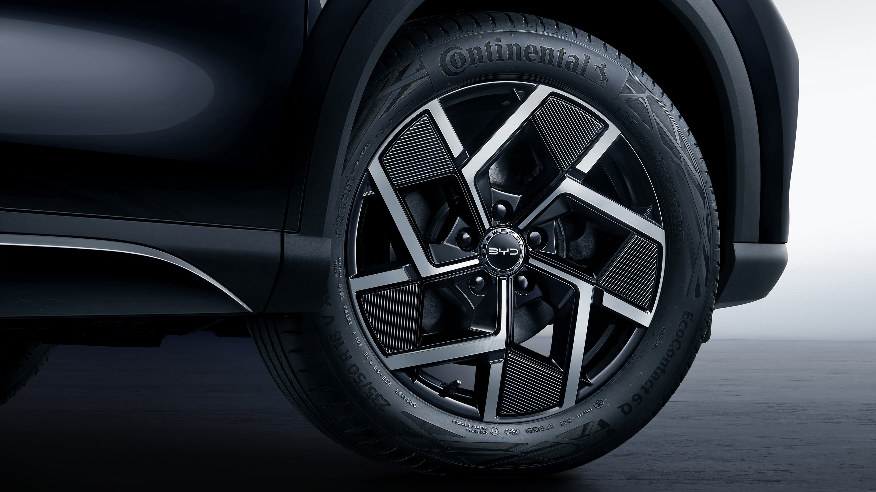 Drawstring top with elastic loop closure and textured interior padding.