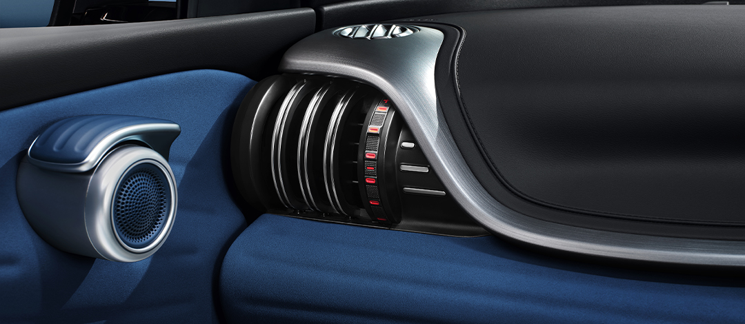 Detail of zipper pull with tan leather and silver rivet.