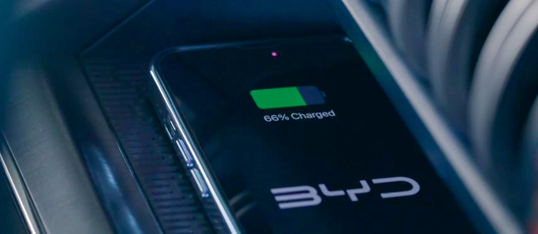 Detail of zipper pull with tan leather and silver rivet.