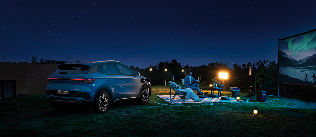 Detail of zipper pull with tan leather and silver rivet.