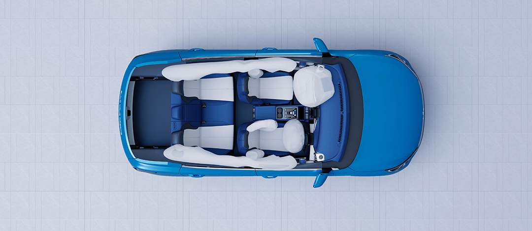 White canvas laptop sleeve with gray felt interior, silver zipper, and tan leather zipper pull.