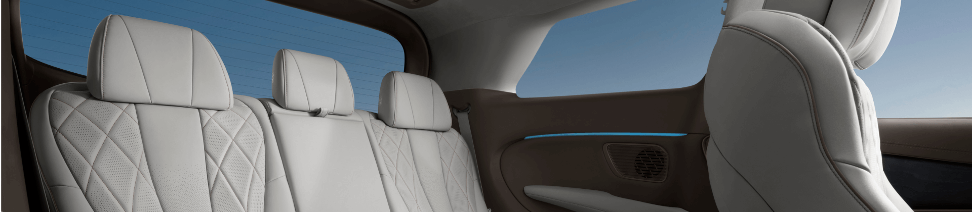 White canvas laptop sleeve with gray felt interior, silver zipper, and tan leather zipper pull.