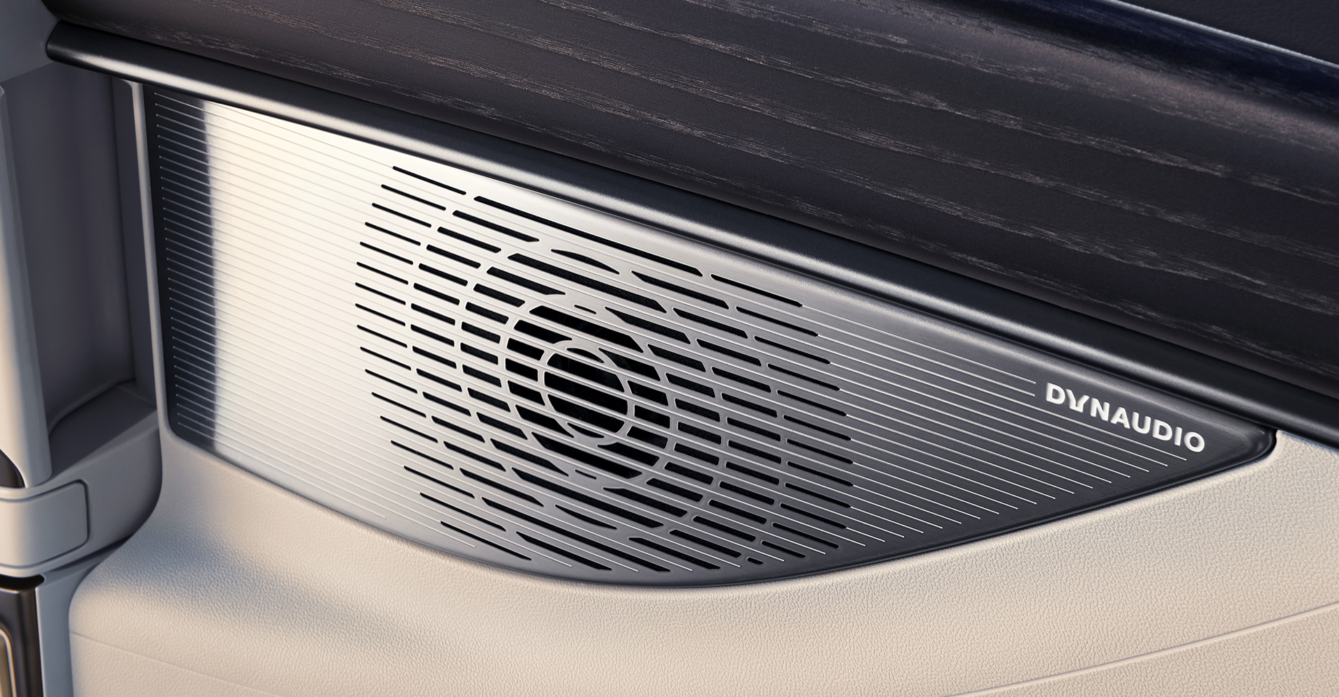 Detail of zipper pull with tan leather and silver rivet.