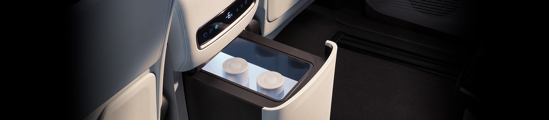 Detail of zipper pull with tan leather and silver rivet.