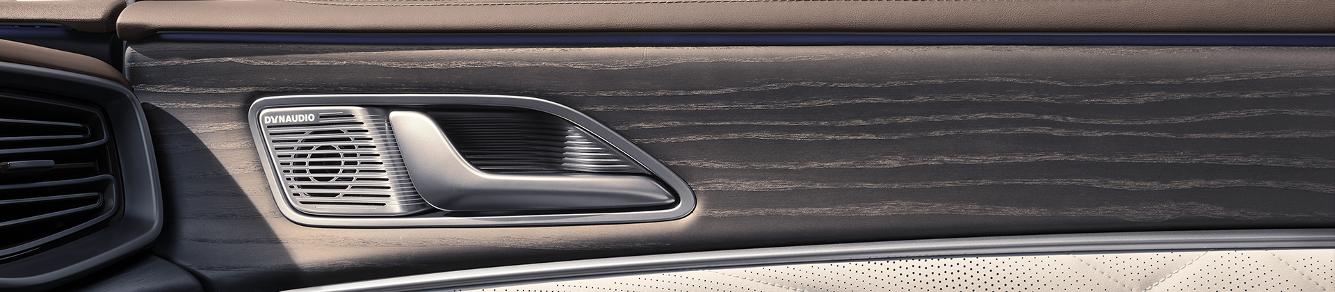 White canvas laptop sleeve with gray felt interior, silver zipper, and tan leather zipper pull.