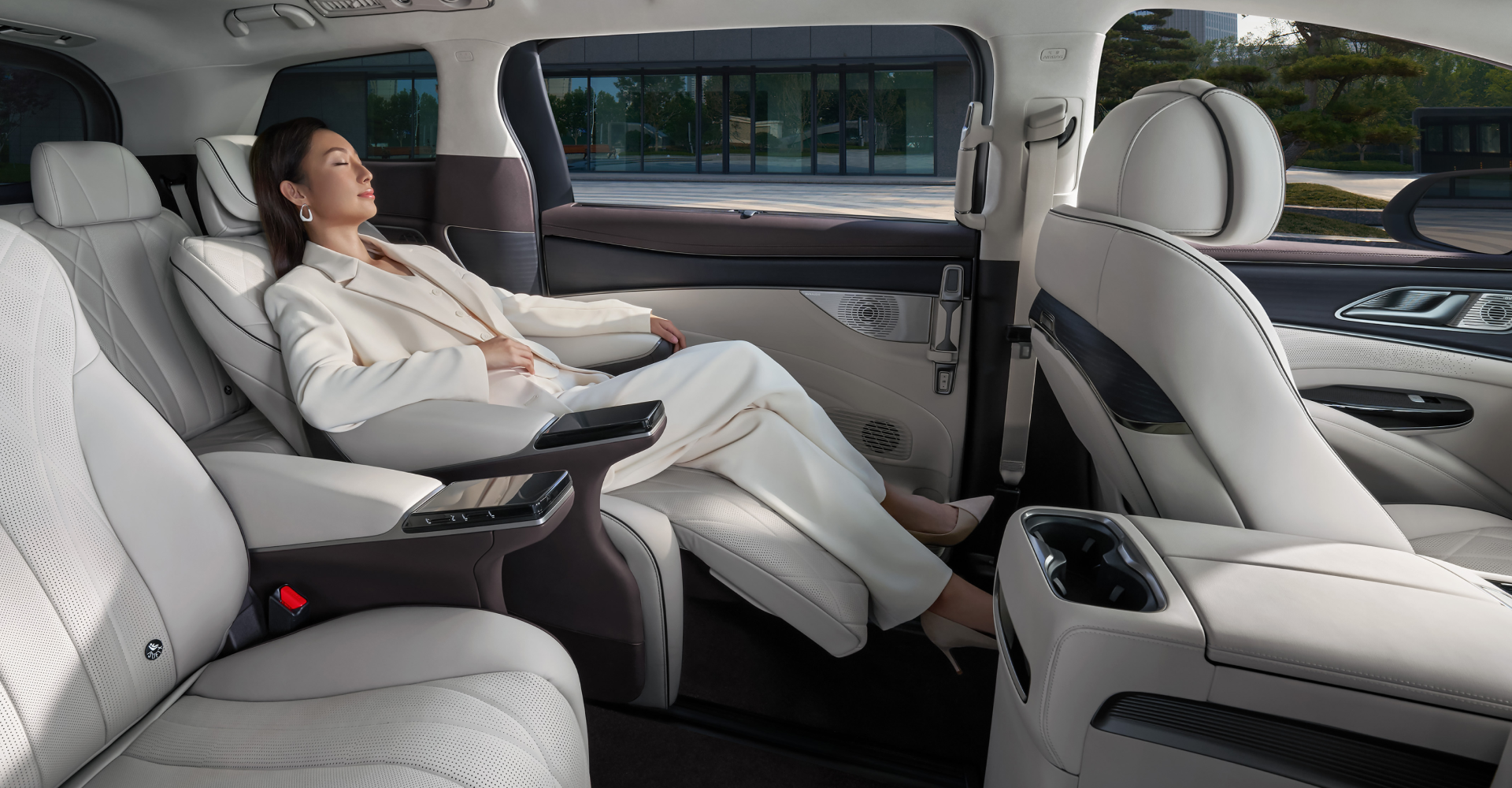 Detail of zipper pull with tan leather and silver rivet.