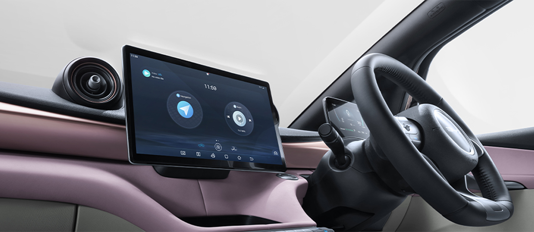 White canvas laptop sleeve with gray felt interior, silver zipper, and tan leather zipper pull.