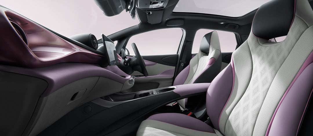 Detail of zipper pull with tan leather and silver rivet.