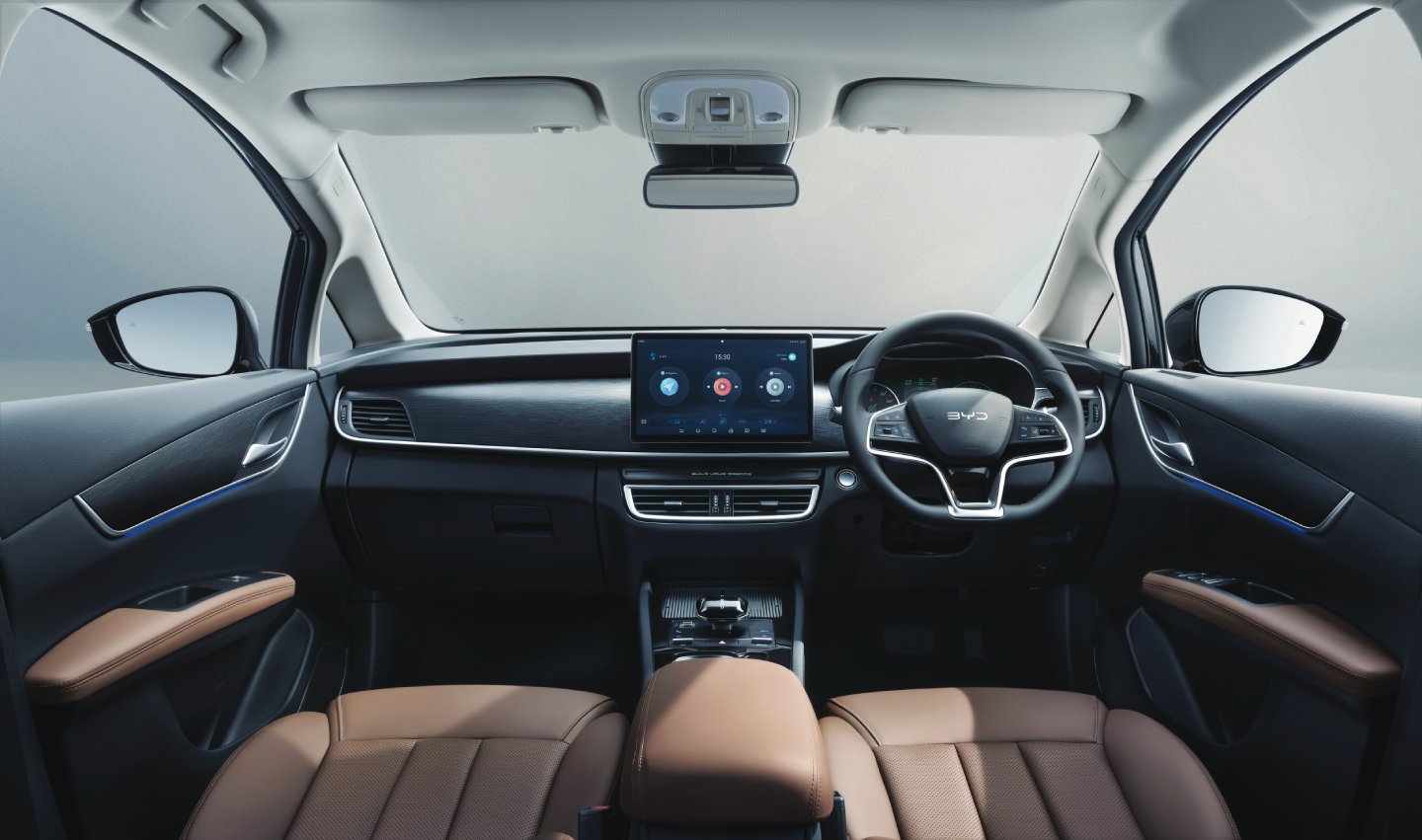 Detail of zipper pull with tan leather and silver rivet.