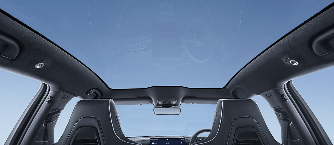 White canvas laptop sleeve with gray felt interior, silver zipper, and tan leather zipper pull.