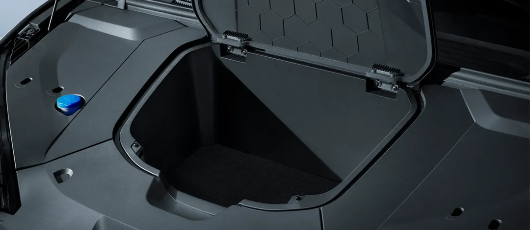 Detail of zipper pull with tan leather and silver rivet.