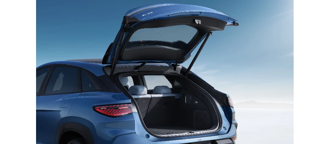 Detail of zipper pull with tan leather and silver rivet.