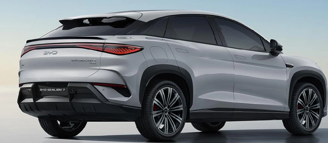 White canvas laptop sleeve with gray felt interior, silver zipper, and tan leather zipper pull.