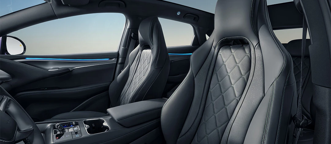 White canvas laptop sleeve with gray felt interior, silver zipper, and tan leather zipper pull.