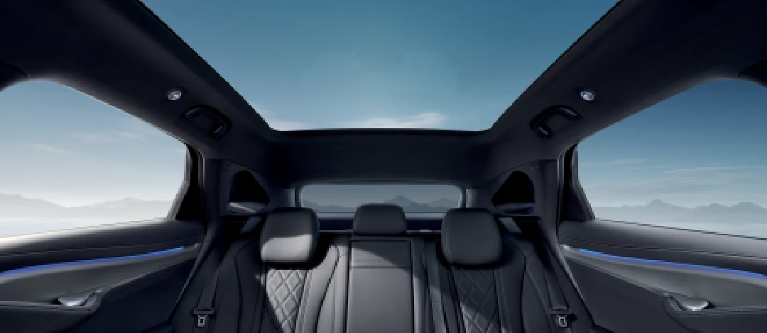 Detail of zipper pull with tan leather and silver rivet.