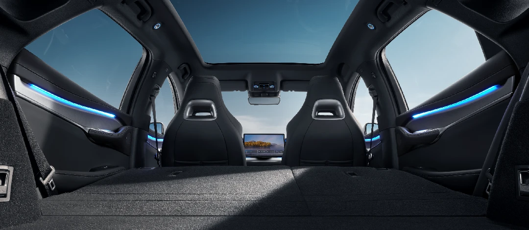 White canvas laptop sleeve with gray felt interior, silver zipper, and tan leather zipper pull.