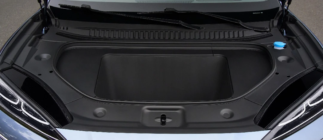 White canvas laptop sleeve with gray felt interior, silver zipper, and tan leather zipper pull.